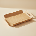 woodnestcraft light oak solid wood serving tray with cut-out handles on a neutral background