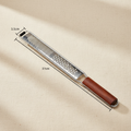 woodnestcraft kitchen grater with a dark Padauk wood handle and a long stainless steel blade for zesting and grating