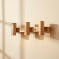 woodnestcraft three-head rustic log-style wooden wall sconce with a natural rubber wood finish on a beige wall